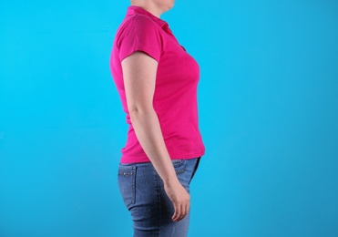 Overweight woman before weight loss on color background