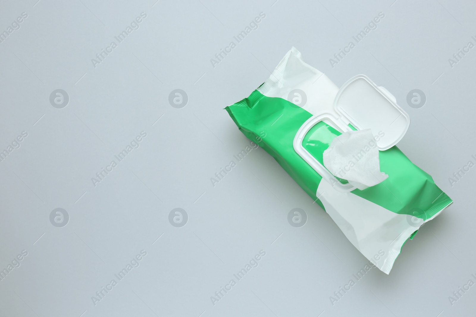 Image of Wet wipes flow pack on light background, top view. Space for text