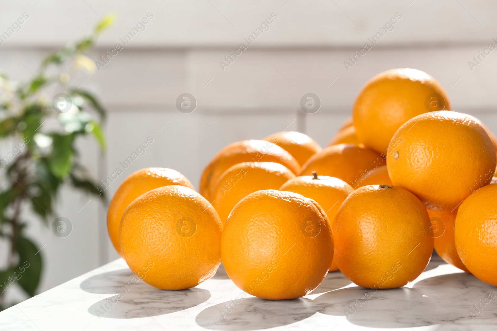 Photo of Fresh juicy oranges on table, space for text. Healthy fruits