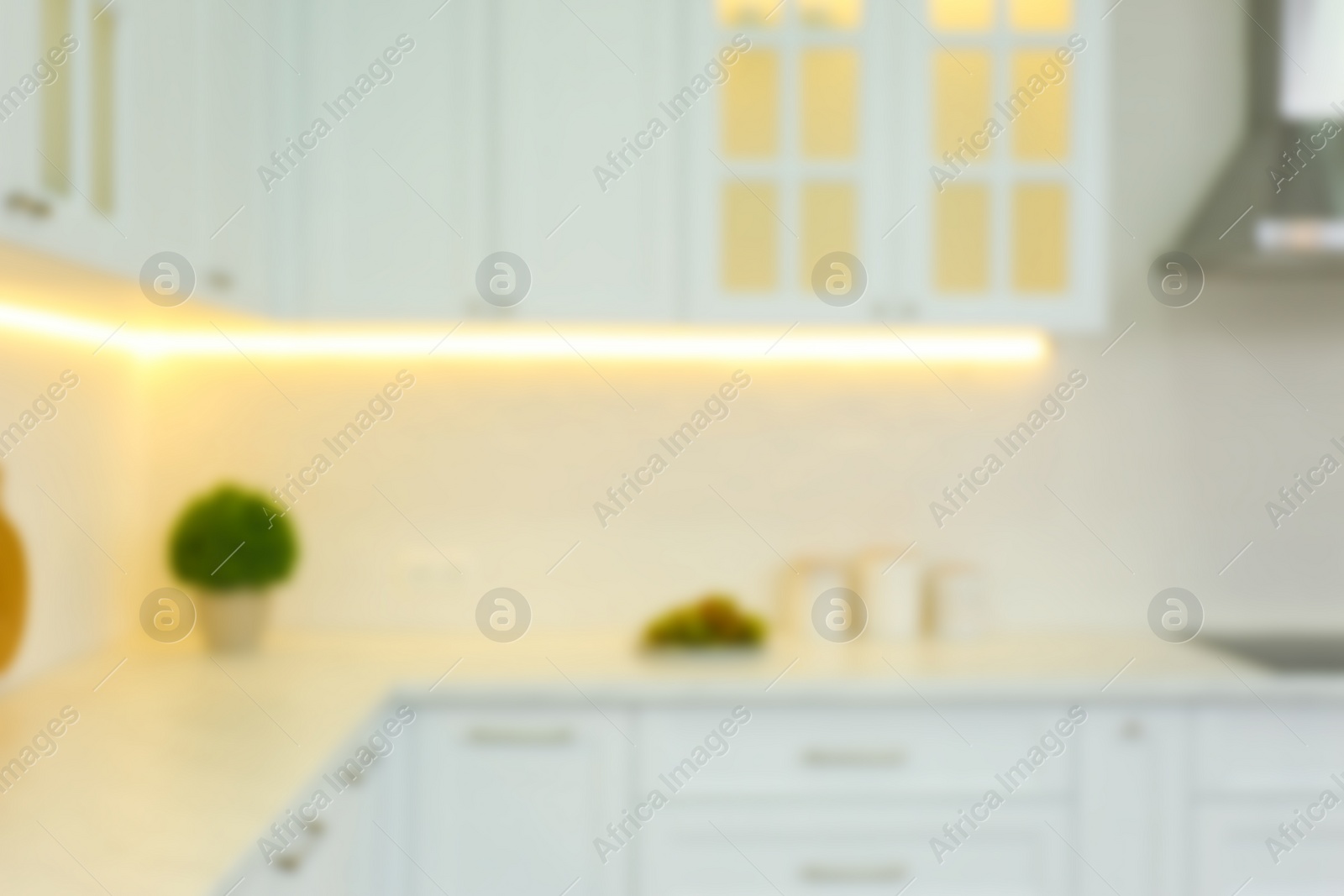 Photo of Blurred view of modern kitchen interior with stylish furniture