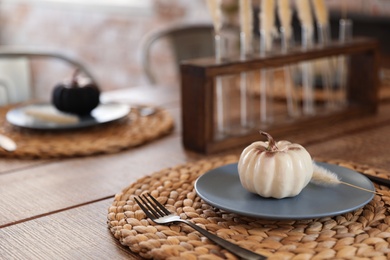 Wooden table decorated for Halloween in kitchen