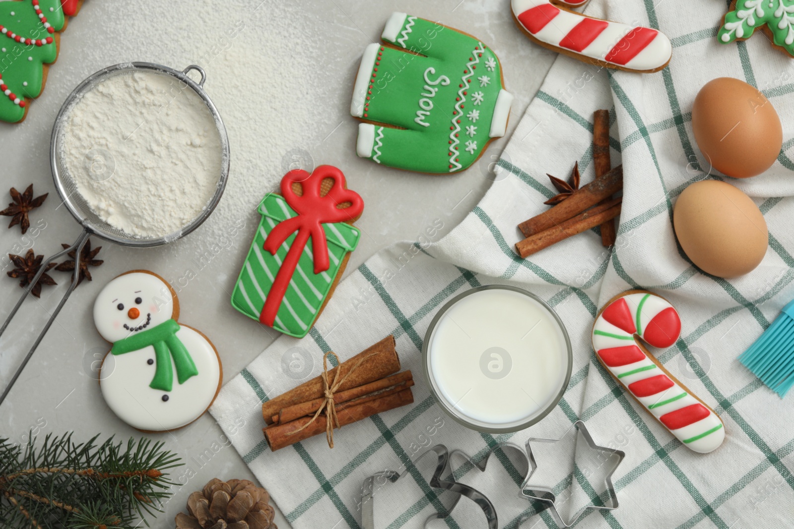 Photo of Flat lay composition with delicious homemade Christmas cookies on grey marble table