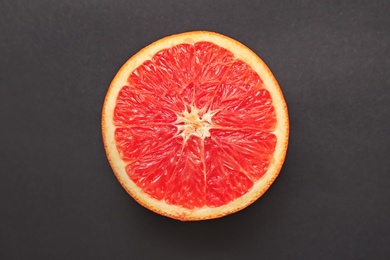 Photo of Fresh yummy orange slice on dark background