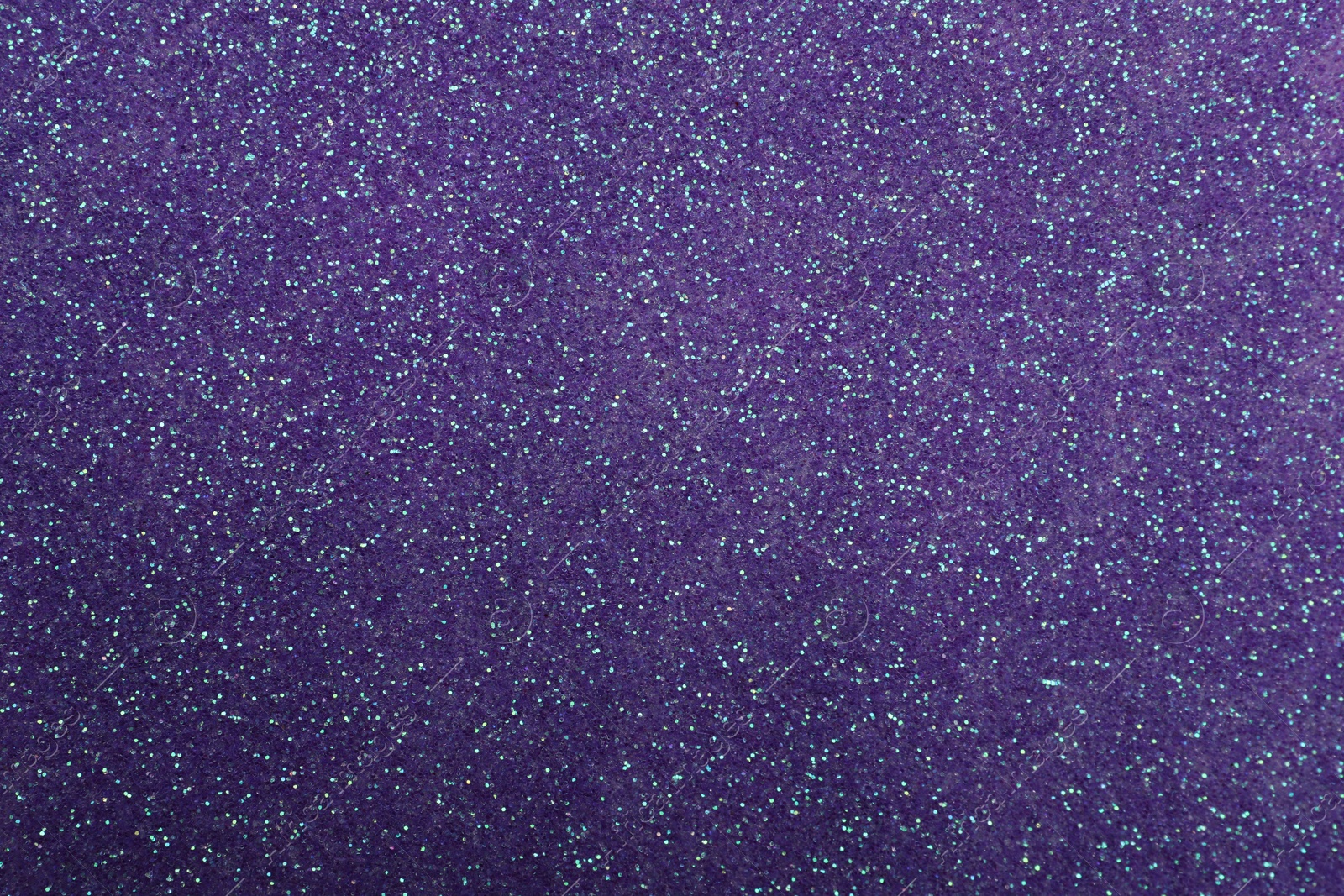 Photo of Beautiful shiny violet glitter as background, closeup