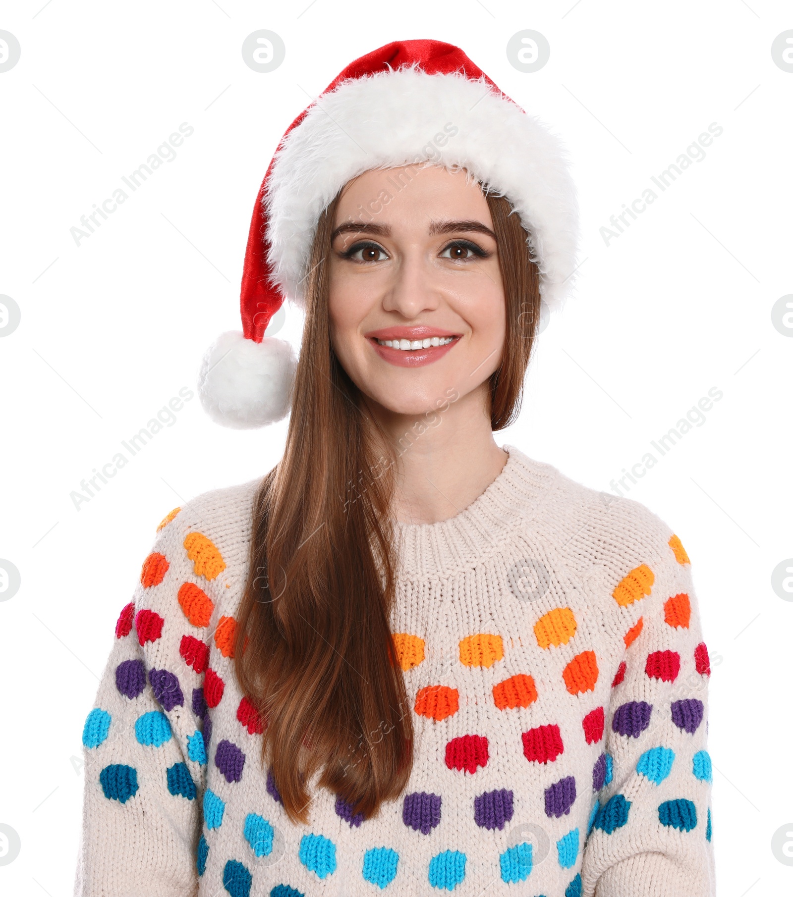 Photo of Happy young woman in Santa hat and sweater on white background. Christmas celebration