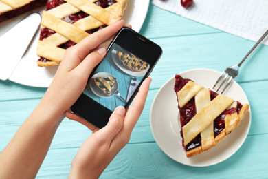 Photo of Blogger taking picture of pie at table, top view