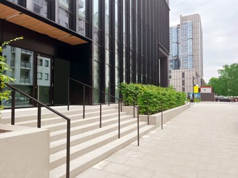 Photo of Beautiful view of city street with building and stairs