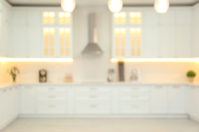 Photo of Blurred view of modern kitchen interior with stylish furniture