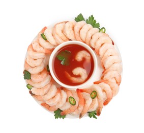 Photo of Tasty boiled shrimps with cocktail sauce, chili and parsley isolated on white, top view