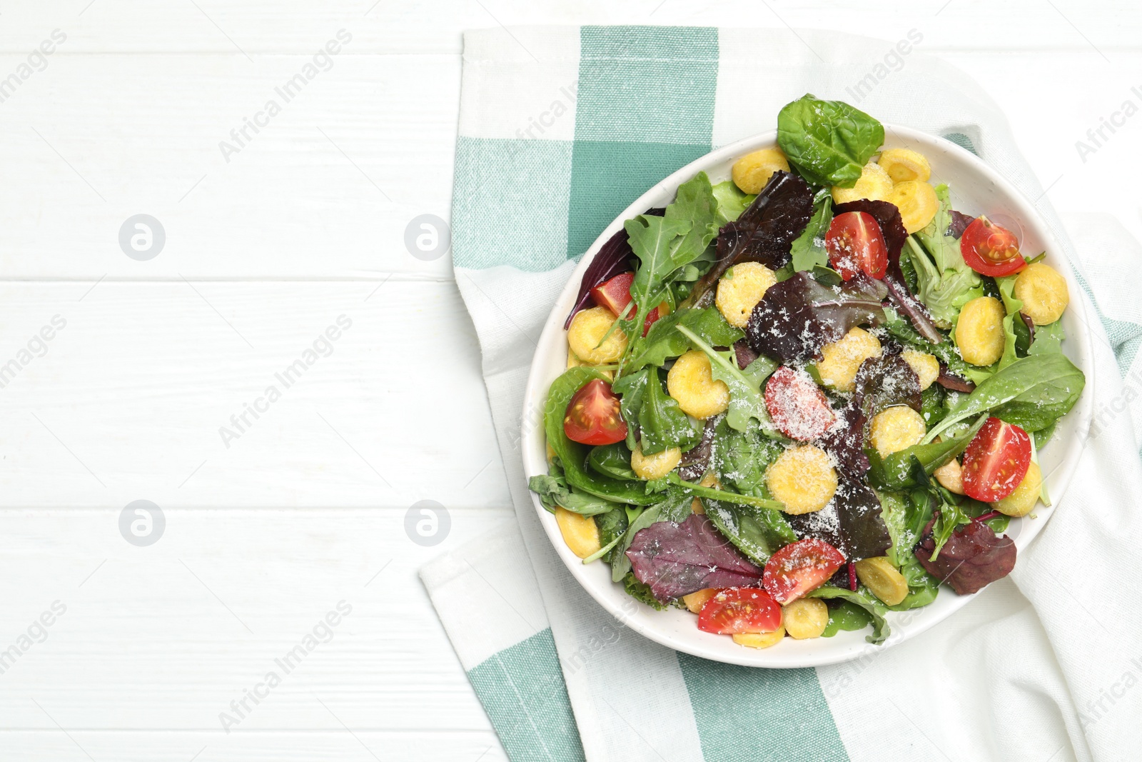 Photo of Delicious fresh carrot salad served on white wooden table, flat lay. Space for text