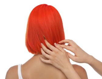 Professional stylist and young woman with bright dyed hair on white background, back view