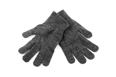 Grey woolen gloves on white background, top view. Winter clothes