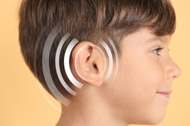 Image of Hearing loss concept. Little boy and sound waves illustration on yellow background, closeup