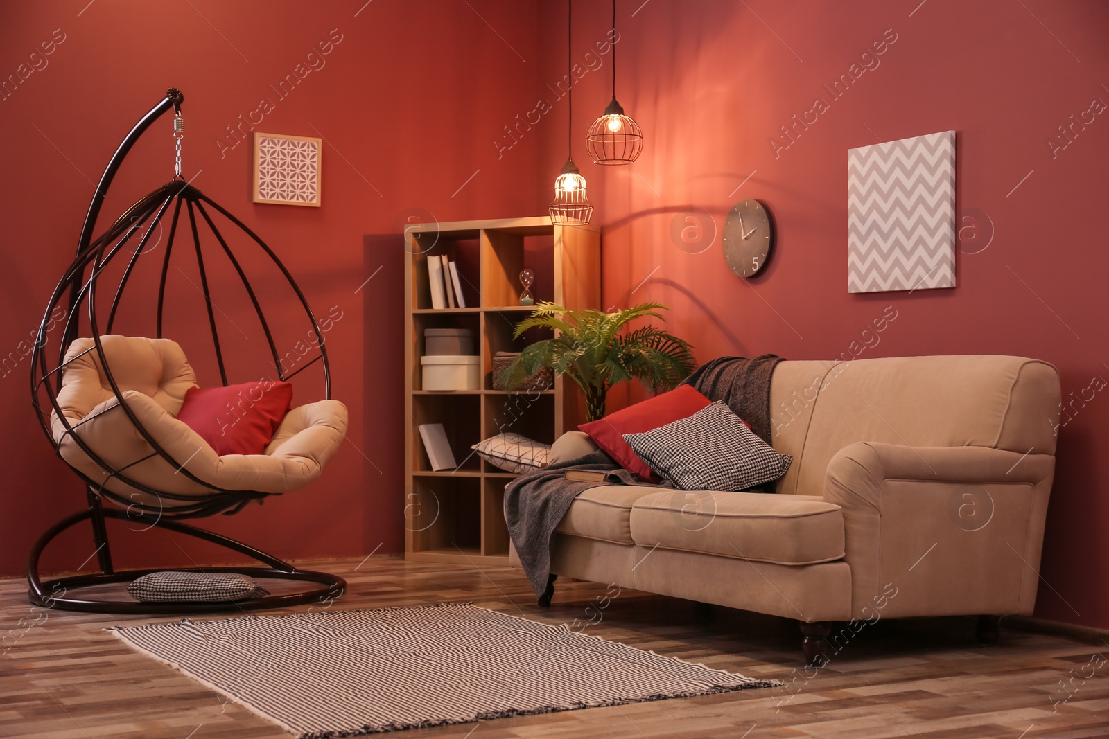 Photo of Elegant living room interior with comfortable sofa and swing chair