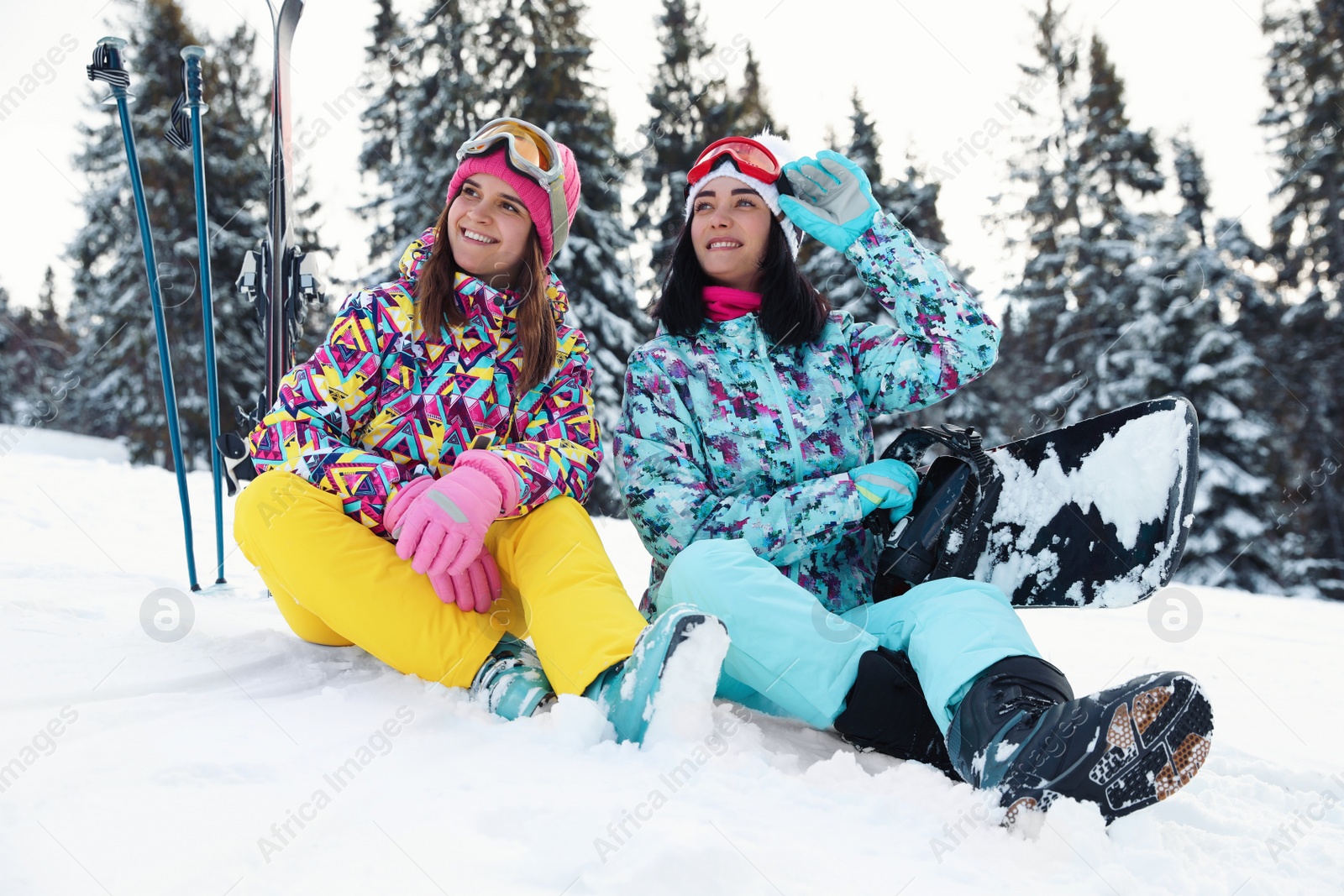 Photo of Friends with equipment on snowy hill. Winter vacation