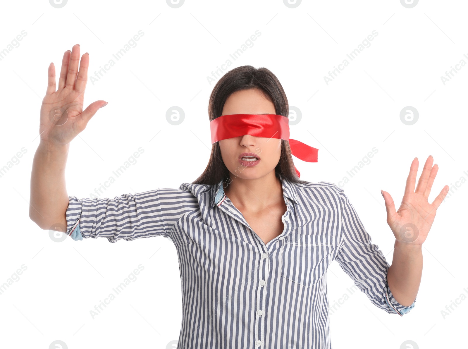 Photo of Young woman wearing red blindfold on white background