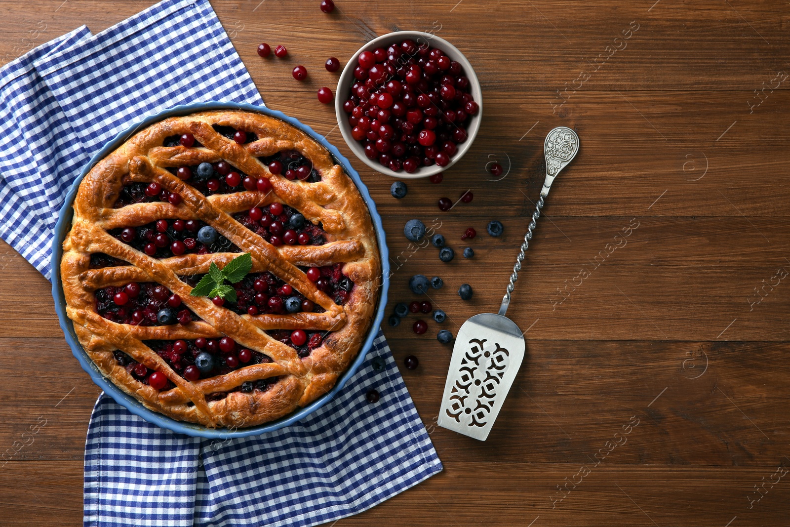 Photo of Delicious currant pie with fresh berries on wooden table, flat lay