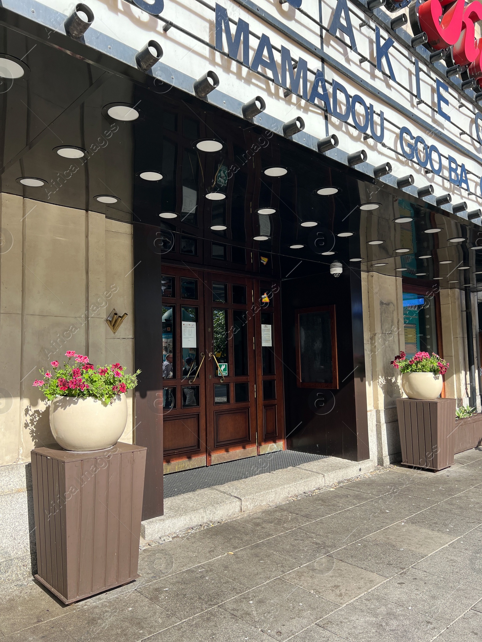 Photo of WARSAW, POLAND - JULY 17, 2022: Building facade of store on city street