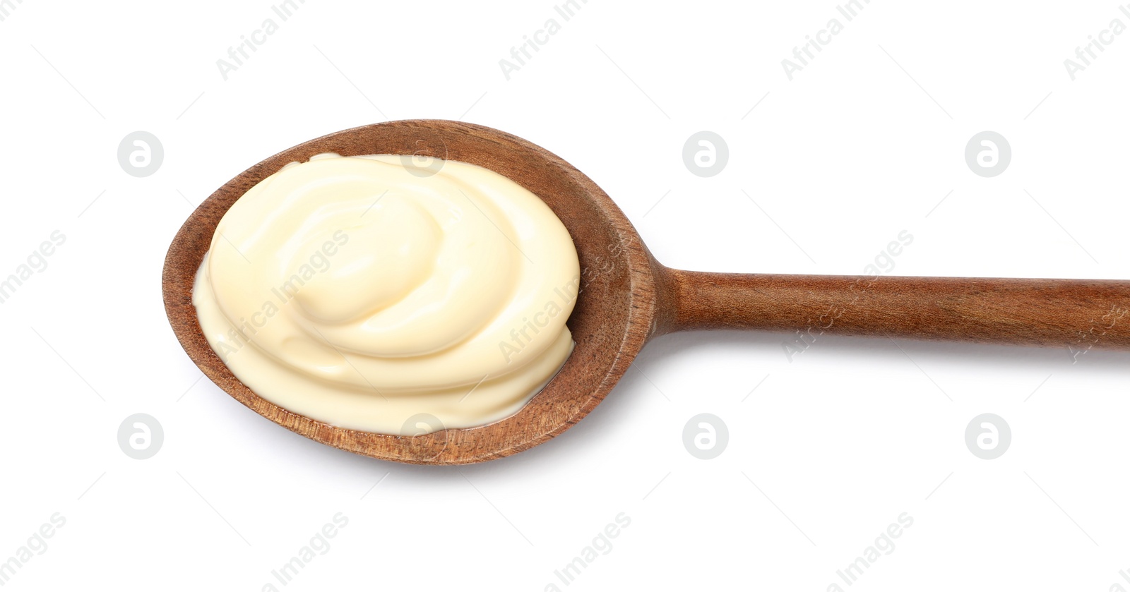 Photo of Wooden spoon with tasty mayonnaise isolated on white, top view