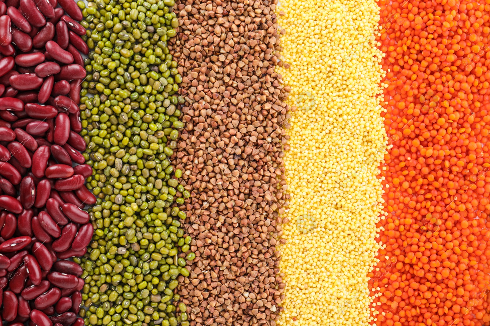 Photo of Different grains and cereals as background, top view