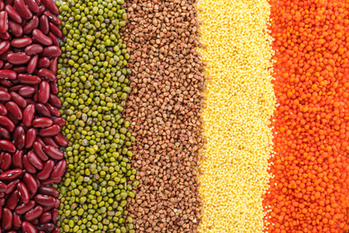 Photo of Different grains and cereals as background, top view