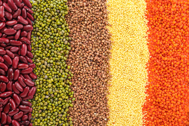 Different grains and cereals as background, top view