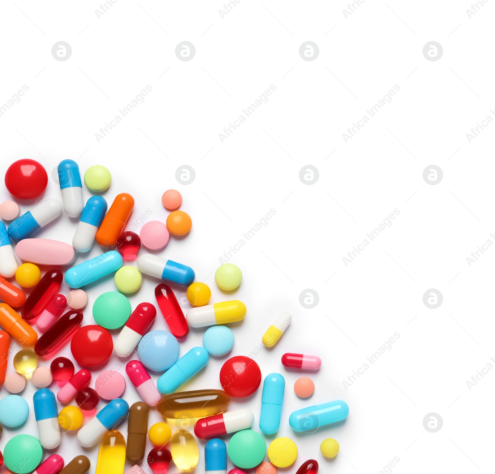 Photo of Lots of different colorful pills isolated on white, top view