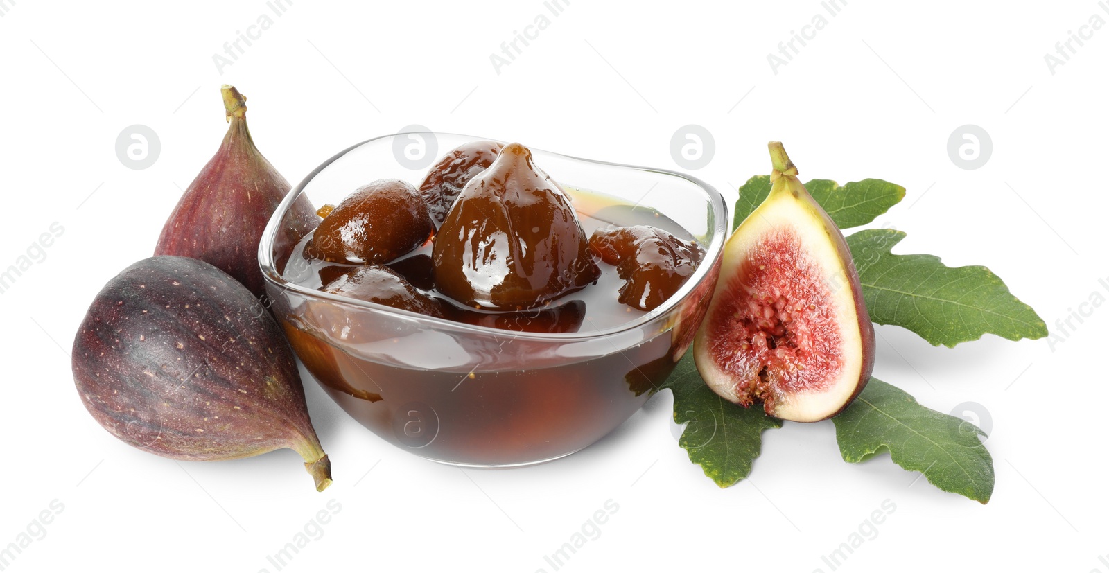 Photo of Bowl of tasty sweet jam, fresh figs and green leaf isolated on white