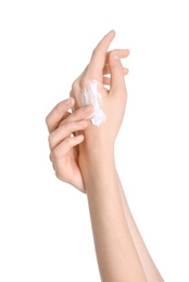 Young woman applying hand cream on white background