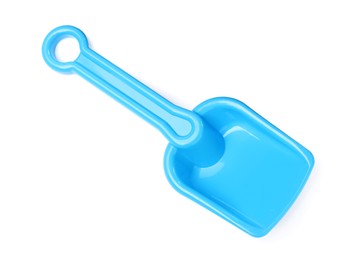Photo of Light blue plastic toy shovel isolated on white, top view