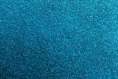 Closeup view of sparkling blue glitter background