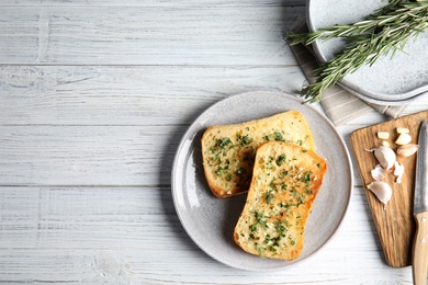 Photo of Flat lay composition with tasty garlic bread and space for text on table