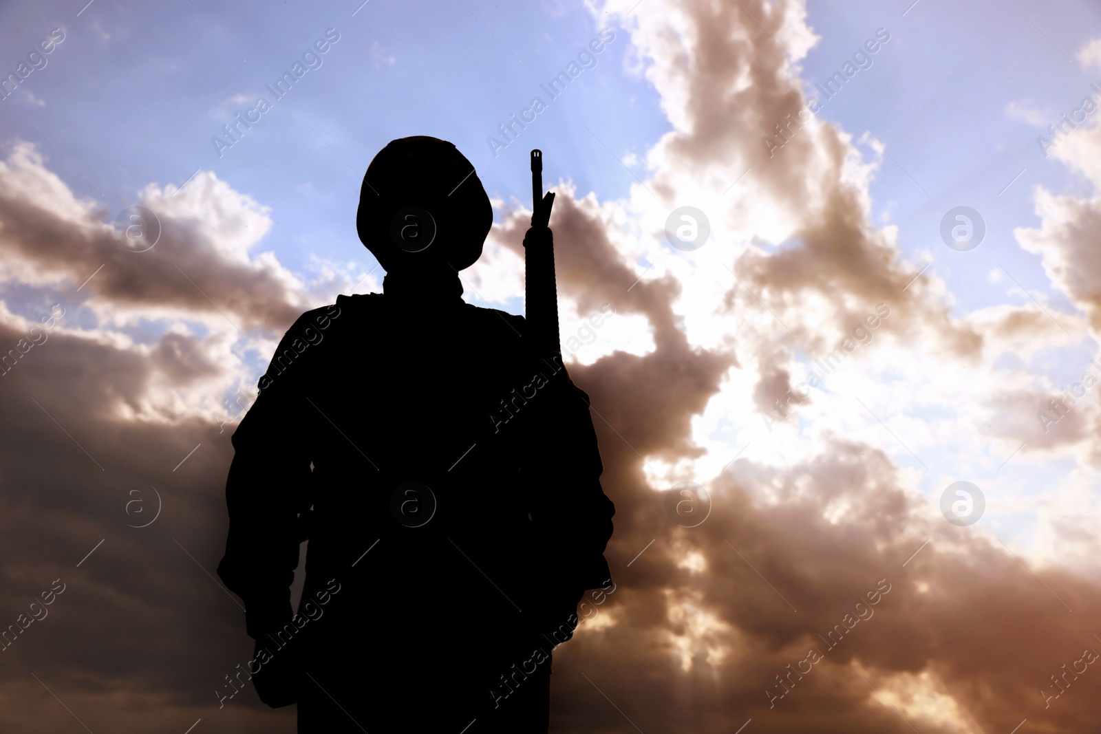 Photo of Soldier with machine gun patrolling outdoors. Military service