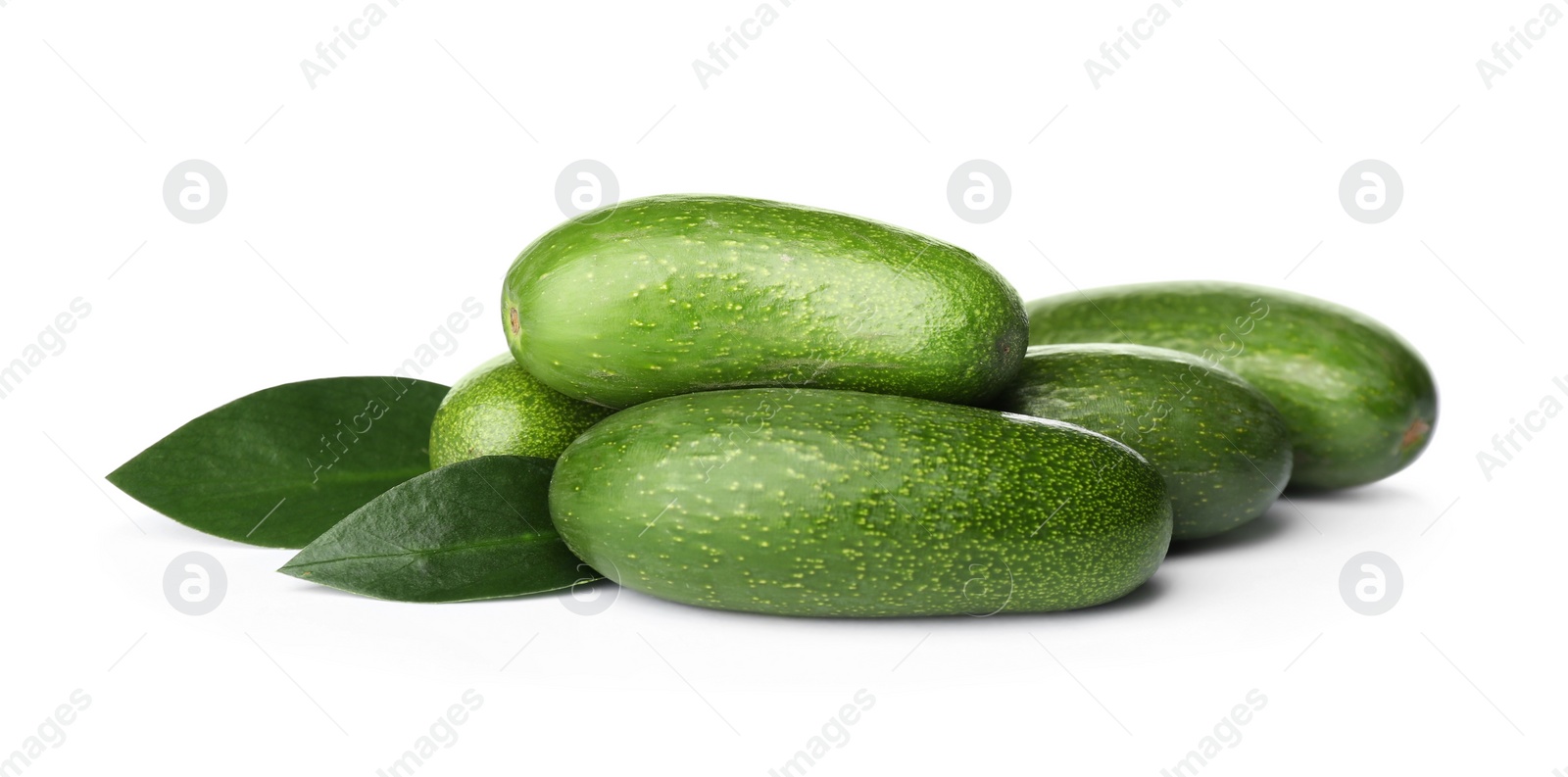 Photo of Fresh whole seedless avocados with leaves isolated on white