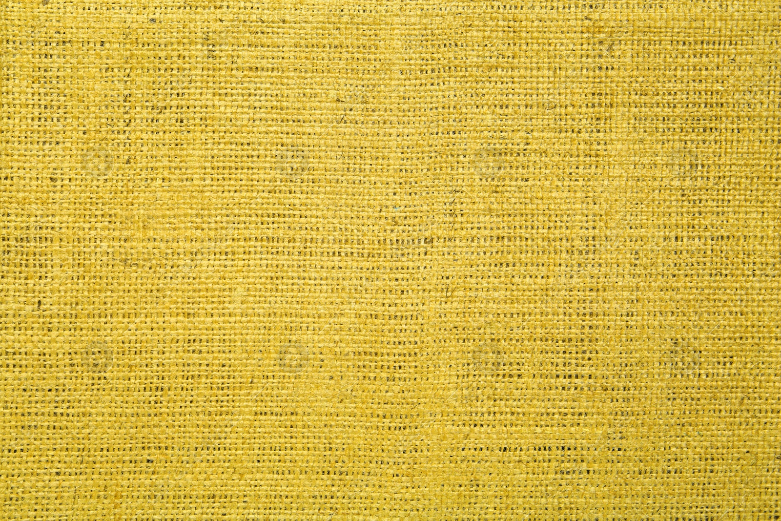 Image of Texture of yellow burlap fabric as background, top view