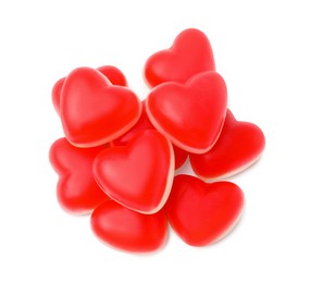 Pile of heart shaped jelly candies on white background, top view