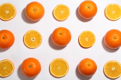 Photo of Flat lay composition with fresh ripe oranges on white background