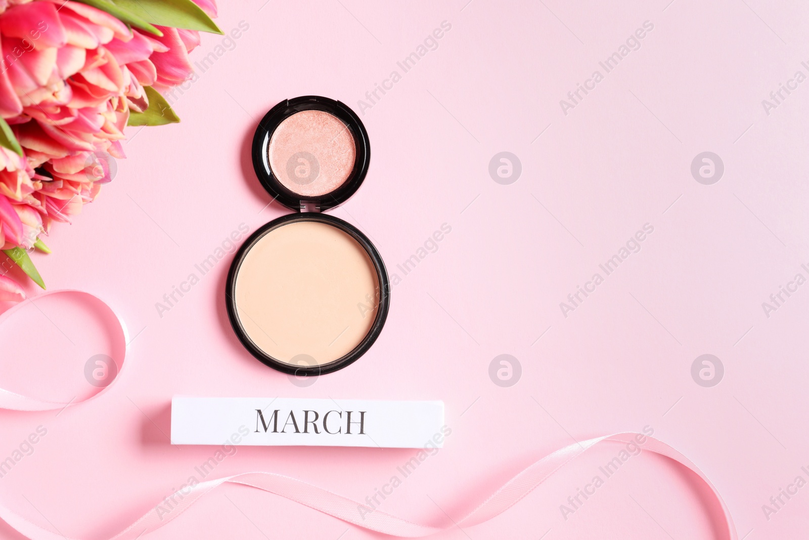 Photo of International Women's day. 8th of March made with makeup powder and beautiful tulips on pink background, flat lay. Space for text