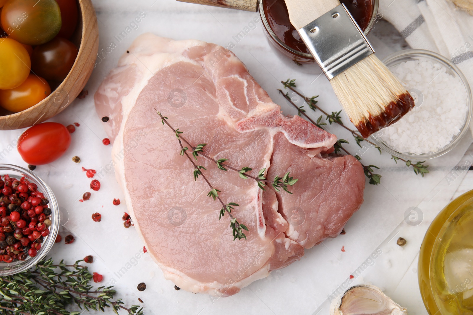 Photo of Flat lay composition with raw meat, thyme and marinade on white table