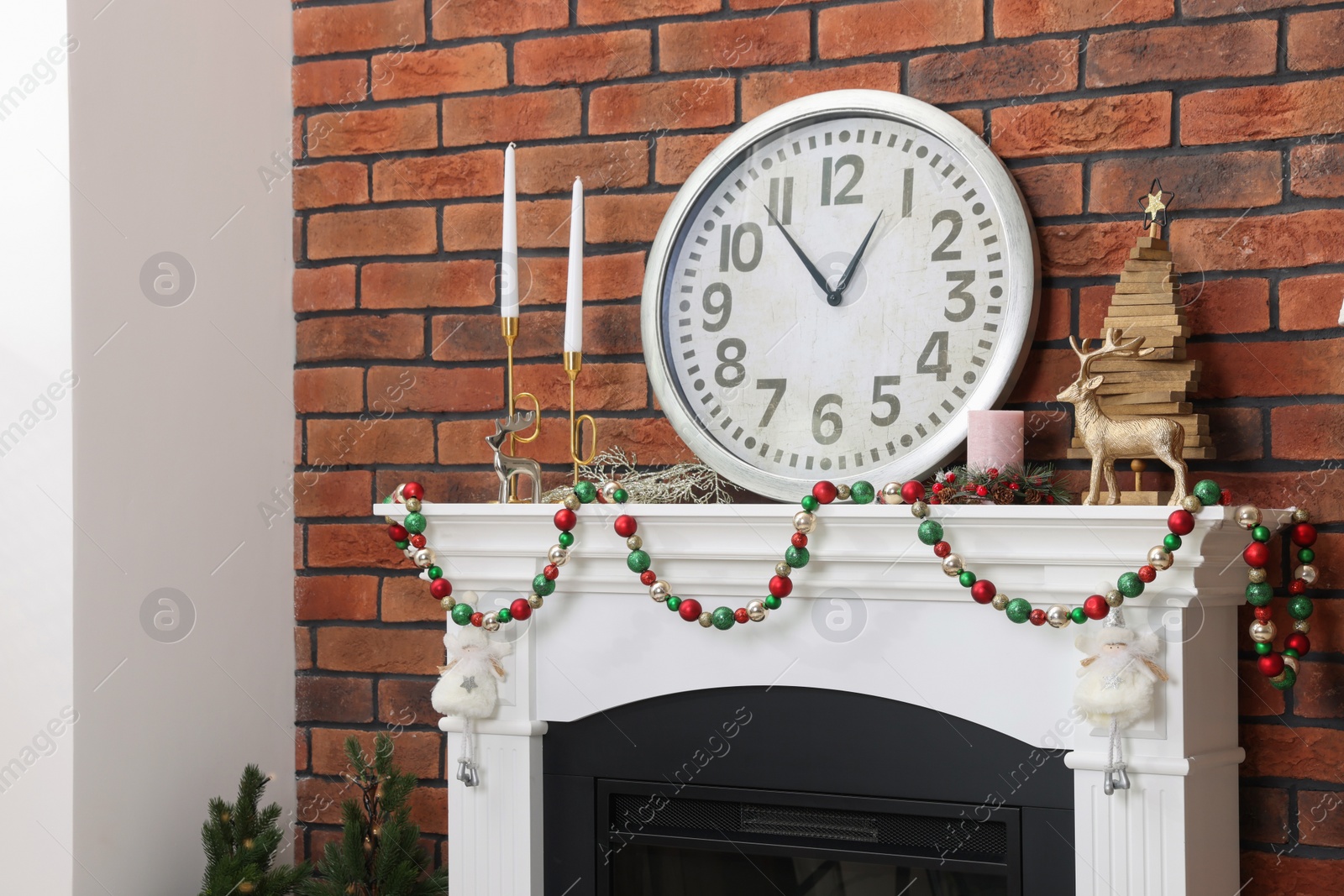 Photo of Modern fireplace decorated for Christmas in living room