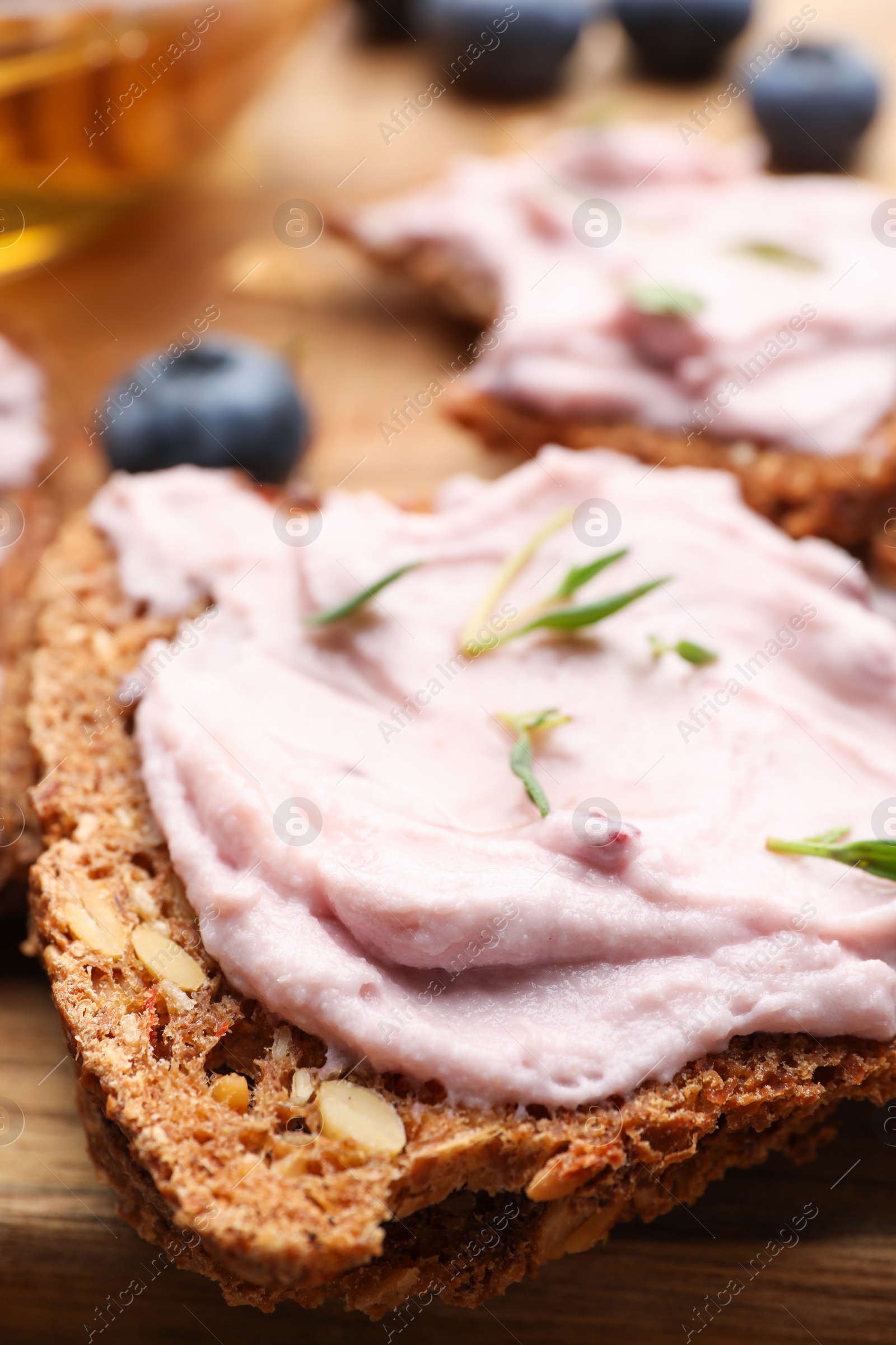 Photo of Tasty sandwiches with cream cheese and thyme, closeup