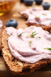 Tasty sandwiches with cream cheese and thyme, closeup