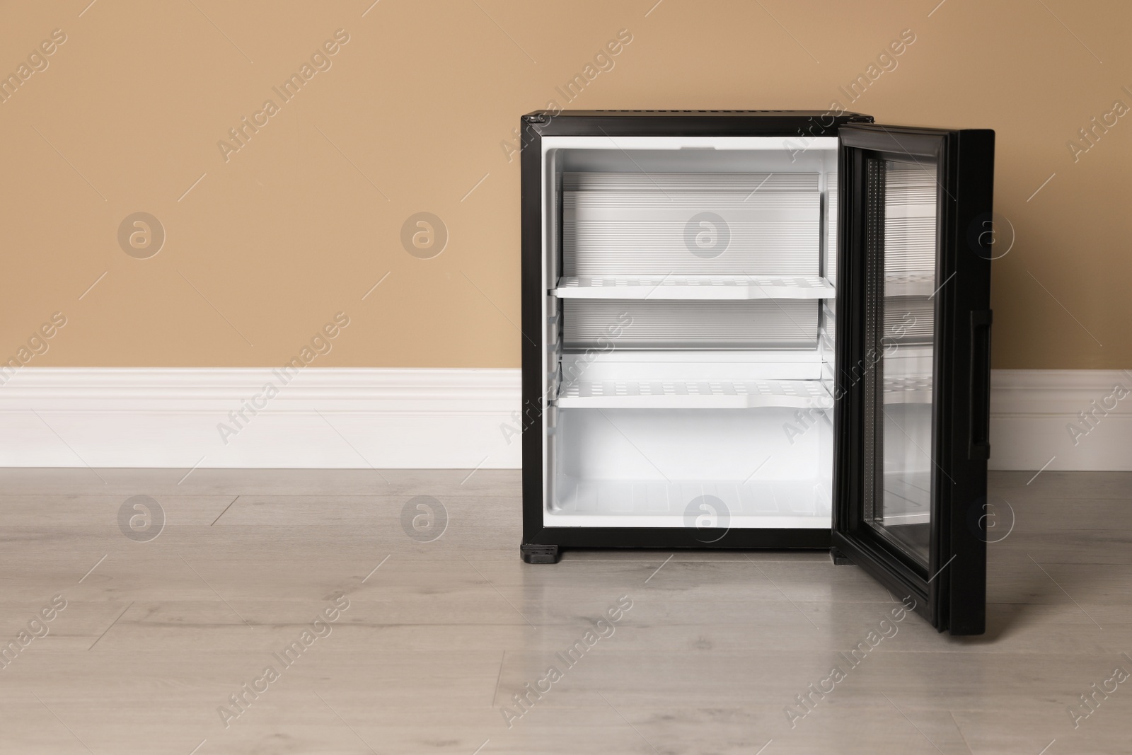 Photo of Empty mini bar near beige wall indoors, space for text