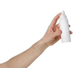 Man holding nasal spray on white background, closeup