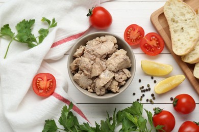 Photo of Flat lay composition with tasty cod liver and different products on white wooden table