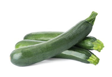 Photo of Raw green ripe zucchinis isolated on white