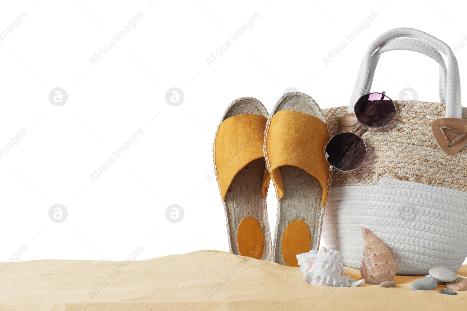 Photo of Composition with beach objects on sand against white background, space for text