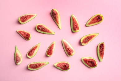 Photo of Fresh ripe fig slices on color background, top view