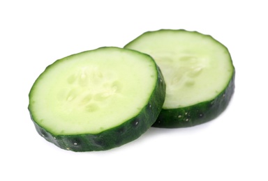 Photo of Slices of fresh cucumber on white background