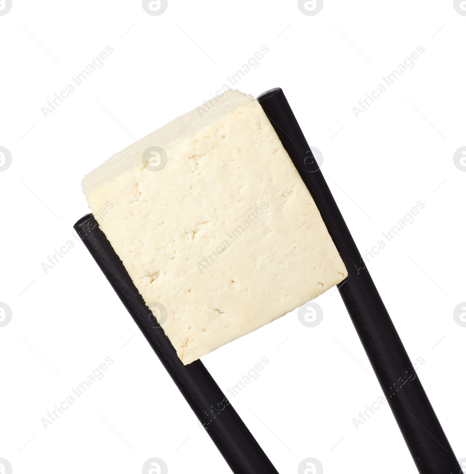 Photo of Chopsticks with delicious raw tofu cube isolated on white